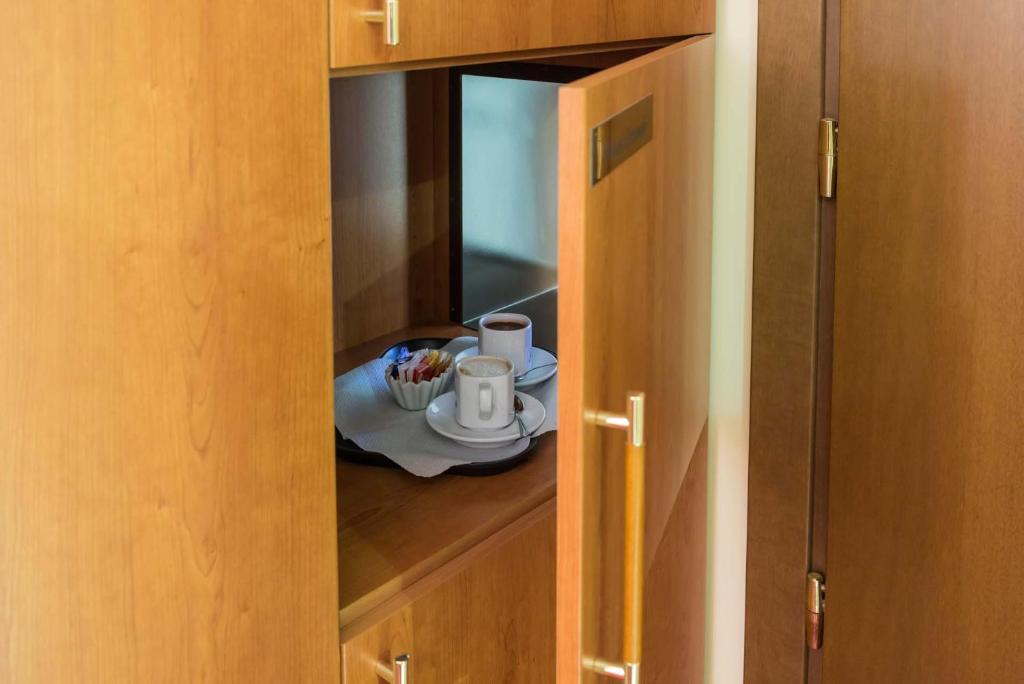 Příslušenství pro přípravu čaje a kávy v ubytování Motel Cuore Gadesco - Hotel - Motel - Cremona - CR