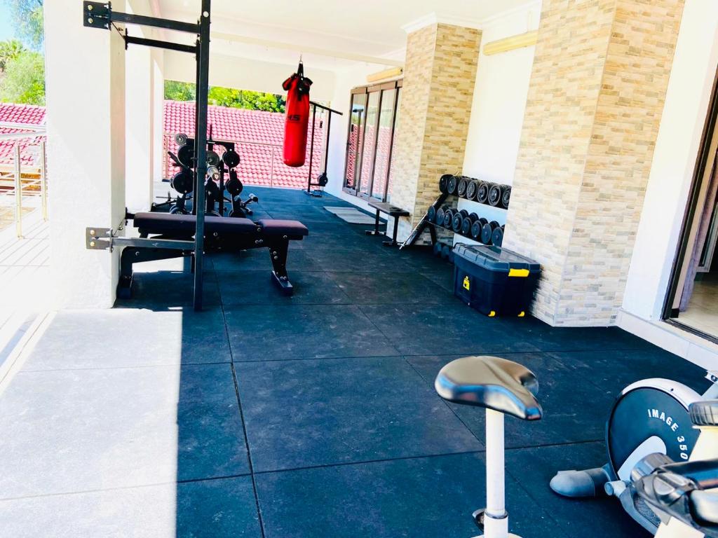 a view of a room with a gym with a gym at C&C HOTEL VIBES Randpark Ridge JHB 14 Units Available in Boskruin