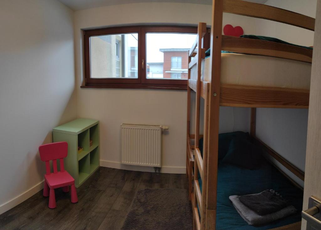 Poschodová posteľ alebo postele v izbe v ubytovaní Apartament Górski