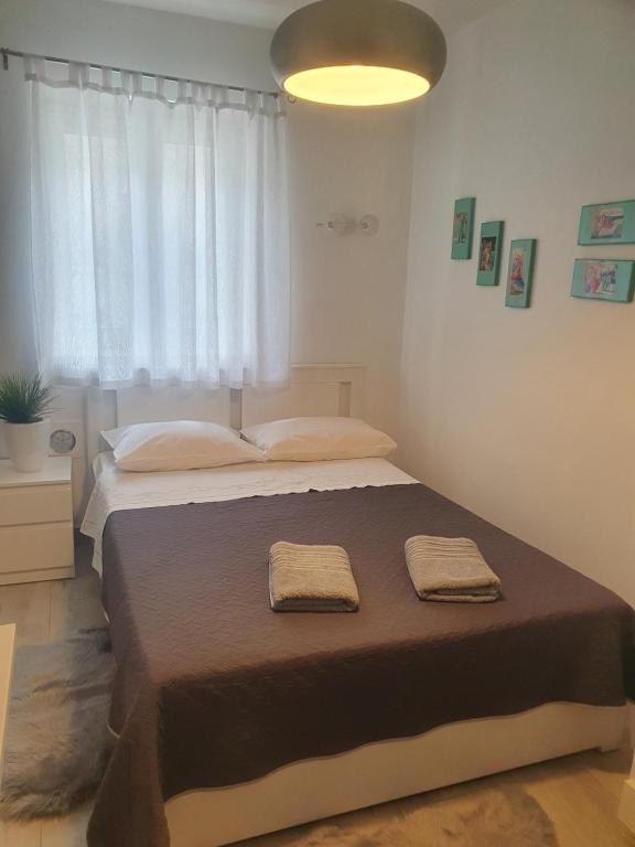 Postel nebo postele na pokoji v ubytování Miriam Rooms Zadar