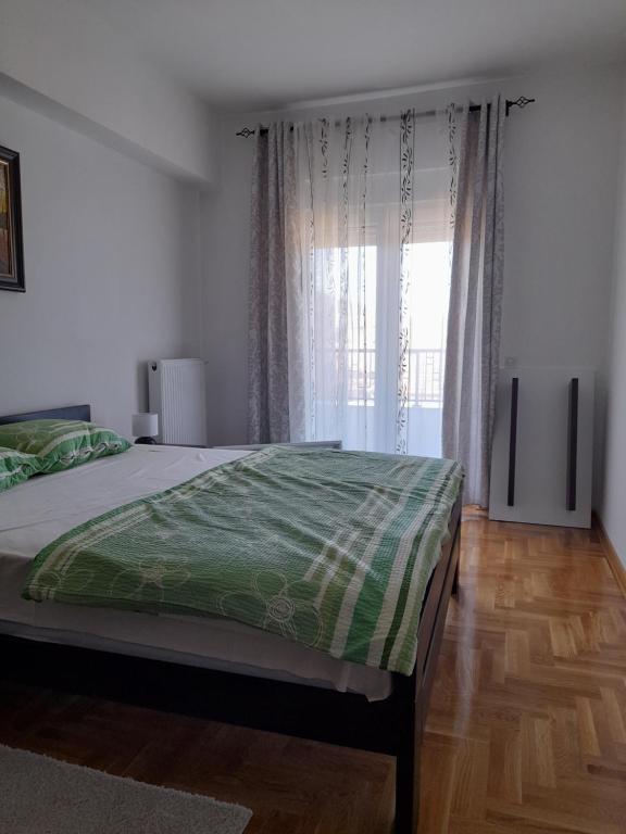 Postel nebo postele na pokoji v ubytování Apartman Green wood