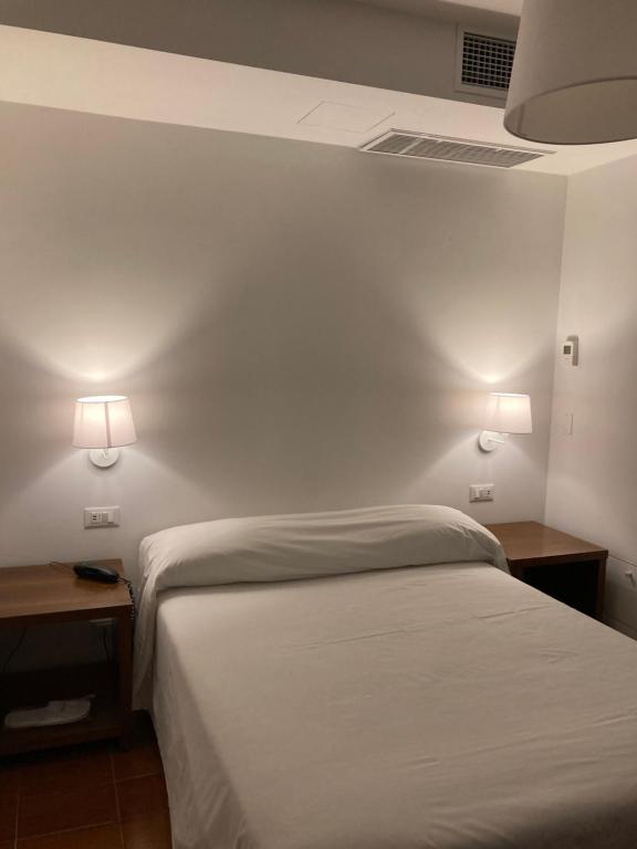 Letto o letti in una camera di Hotel Ghironi