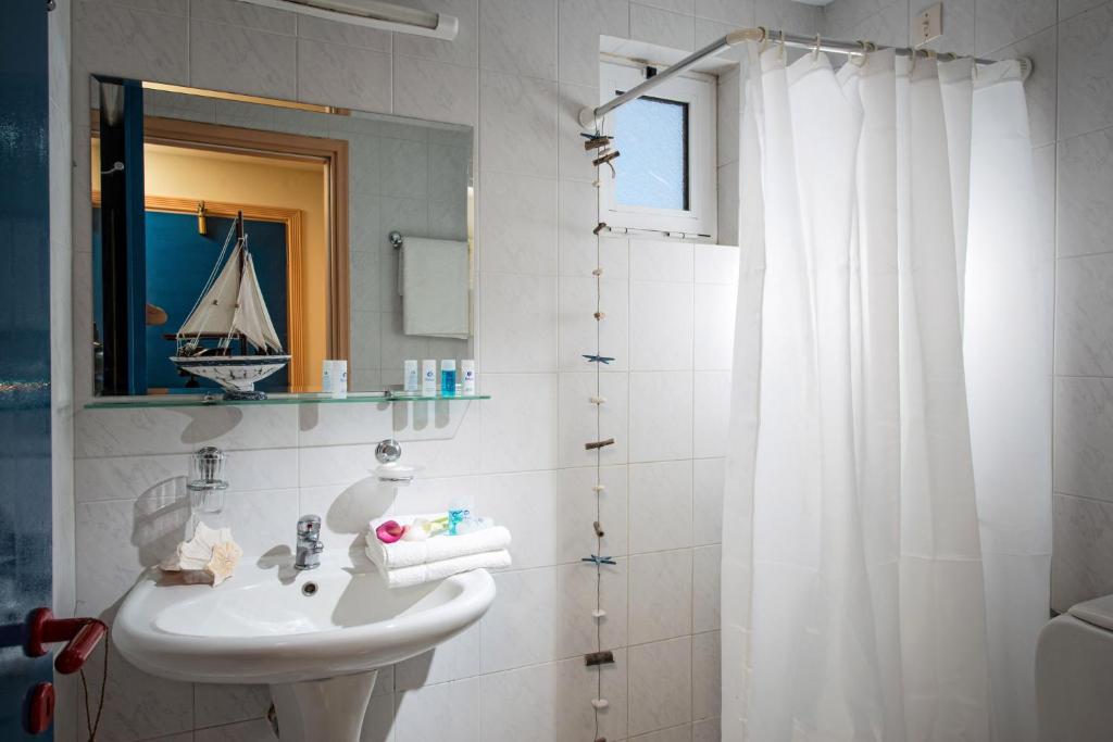 Koupelna v ubytování Astoria Hotel