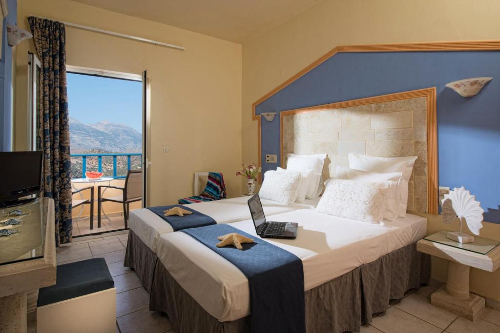 Postel nebo postele na pokoji v ubytování Astoria Hotel