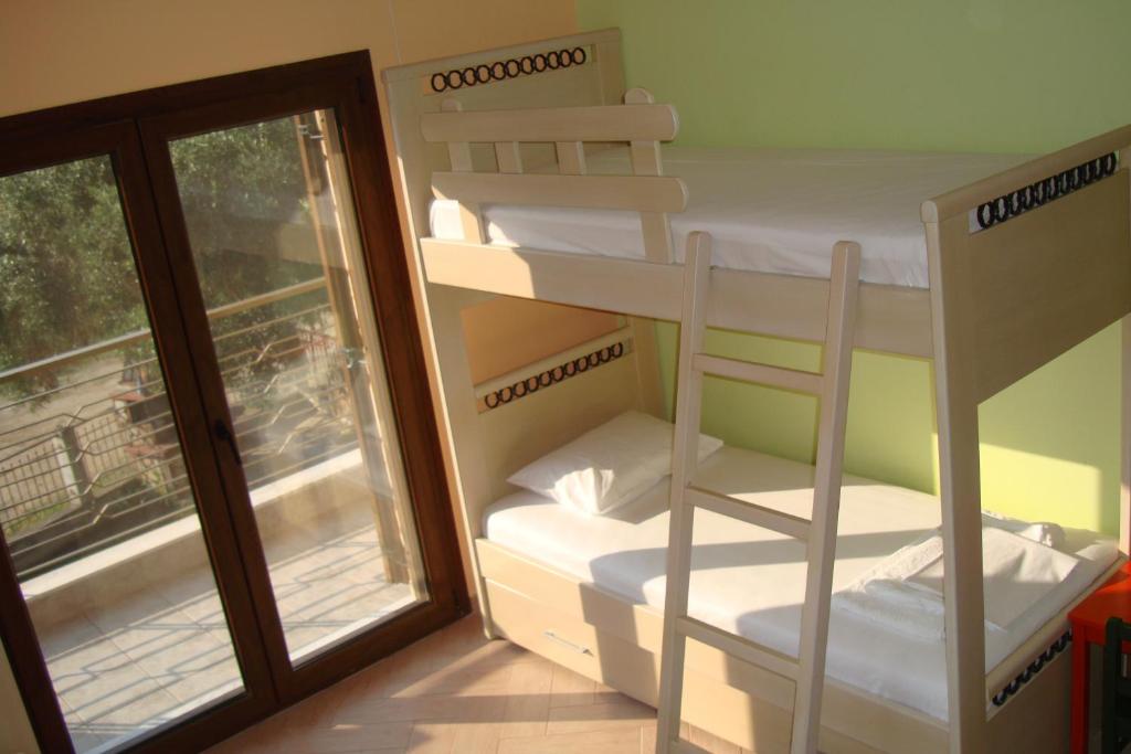Postel nebo postele na pokoji v ubytování Villa Elva