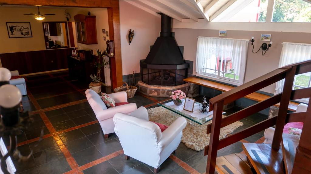 Uma área de estar em Aardvark Inn Pousada