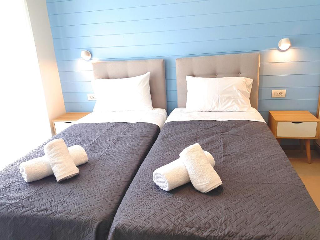 Postel nebo postele na pokoji v ubytování Tamaris Homes