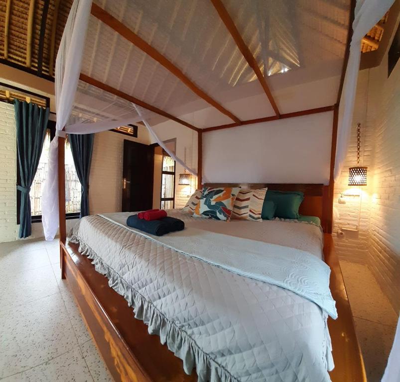 Ein Bett oder Betten in einem Zimmer der Unterkunft JEJU Cottages
