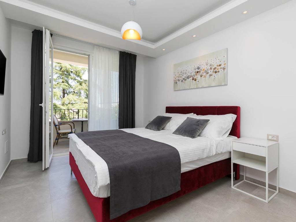 Łóżko lub łóżka w pokoju w obiekcie Nadija Apartmani
