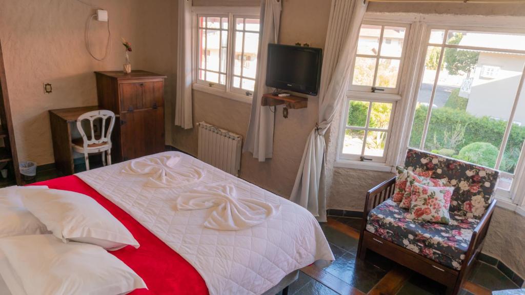 Uma cama ou camas num quarto em Aardvark Inn Pousada