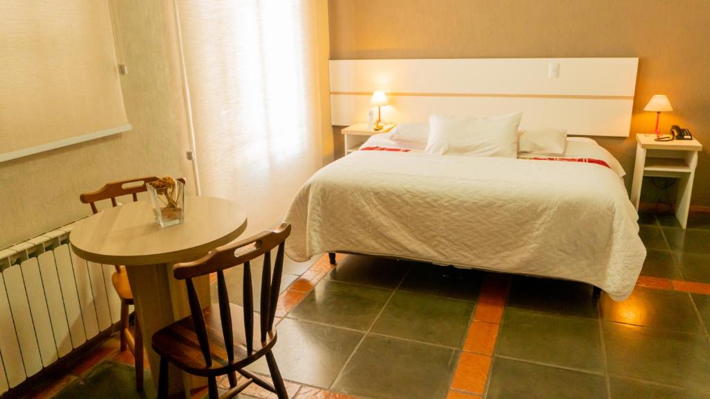 Uma cama ou camas num quarto em Aardvark Inn Pousada