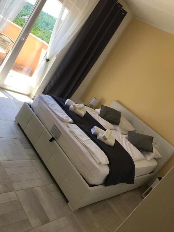 Postel nebo postele na pokoji v ubytování Villa Diana