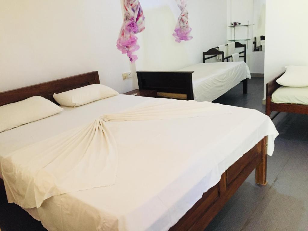 Postel nebo postele na pokoji v ubytování Gimansa Rest Sigiriya