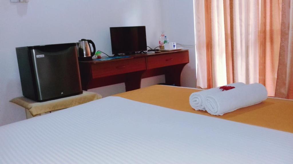 Postel nebo postele na pokoji v ubytování Villa DeLorenta