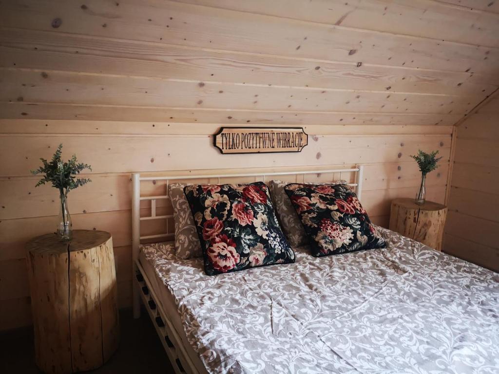 Posteľ alebo postele v izbe v ubytovaní Domki Między Drzewami