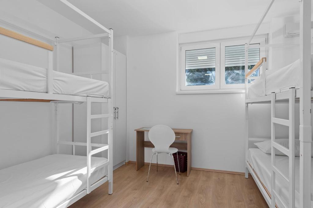Postel nebo postele na pokoji v ubytování Hostel Elli