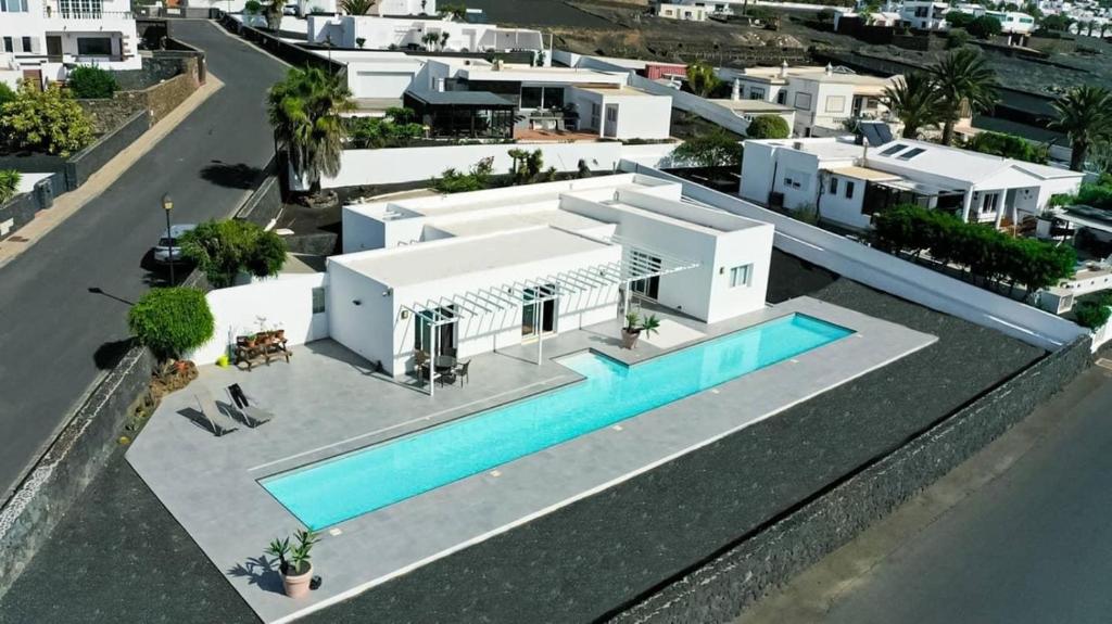 an aerial view of a house with a swimming pool at Casa Conil with a private 25 meter heated pool in Conil