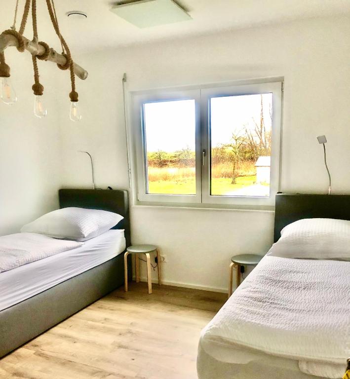 Postel nebo postele na pokoji v ubytování Hostel Hof Kranichstein