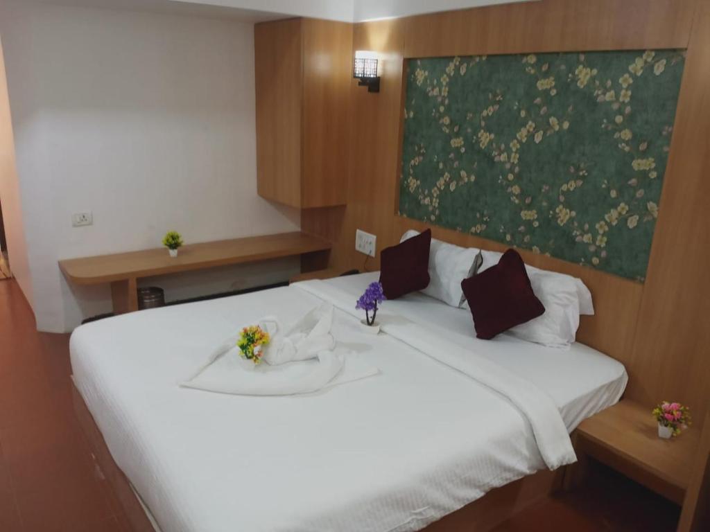 Postel nebo postele na pokoji v ubytování Hotel Kewal