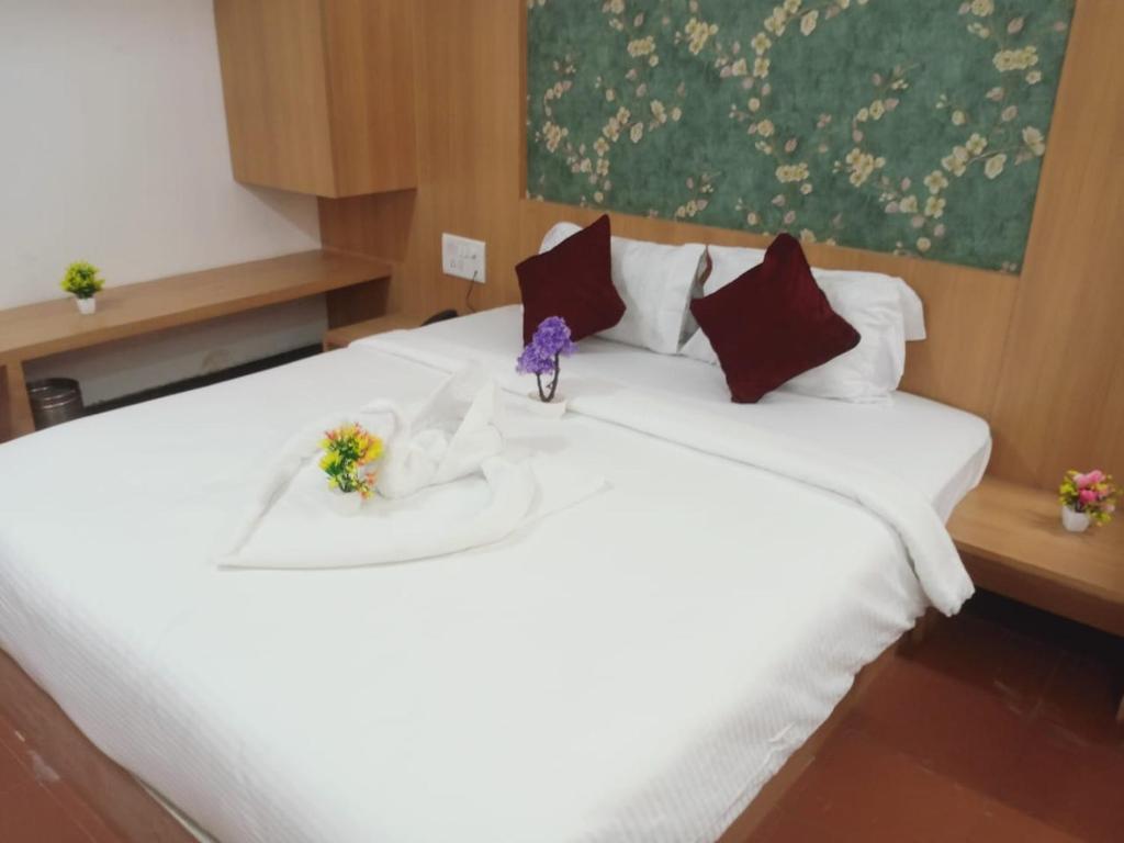 Postel nebo postele na pokoji v ubytování Hotel Kewal