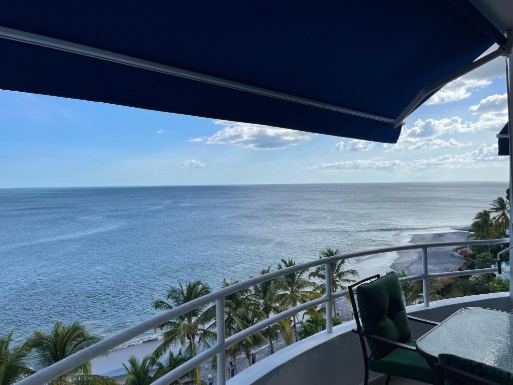 a view of the ocean from the balcony of a resort at Solarium at Coronado Bay Oceanfront Apartments in Playa Coronado