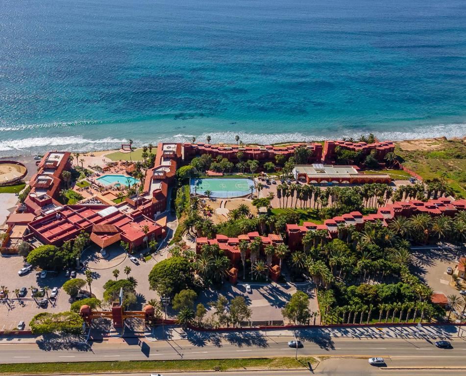 an aerial view of a resort near the ocean at Puerto Nuevo Baja Hotel & Villas in Rosarito