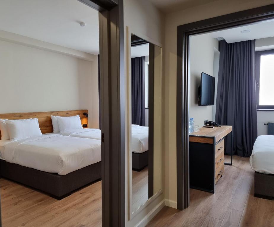 Postel nebo postele na pokoji v ubytování Monte Hotel