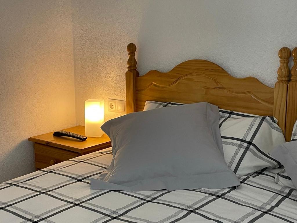 Posteľ alebo postele v izbe v ubytovaní Hervas Centro Apartamento IDEAL FAMILIAS 6 adultos y 2 niños-