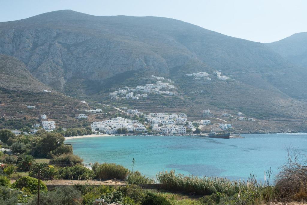 a view of a bay with houses on a mountain at Amorgi Studios in Aegiali