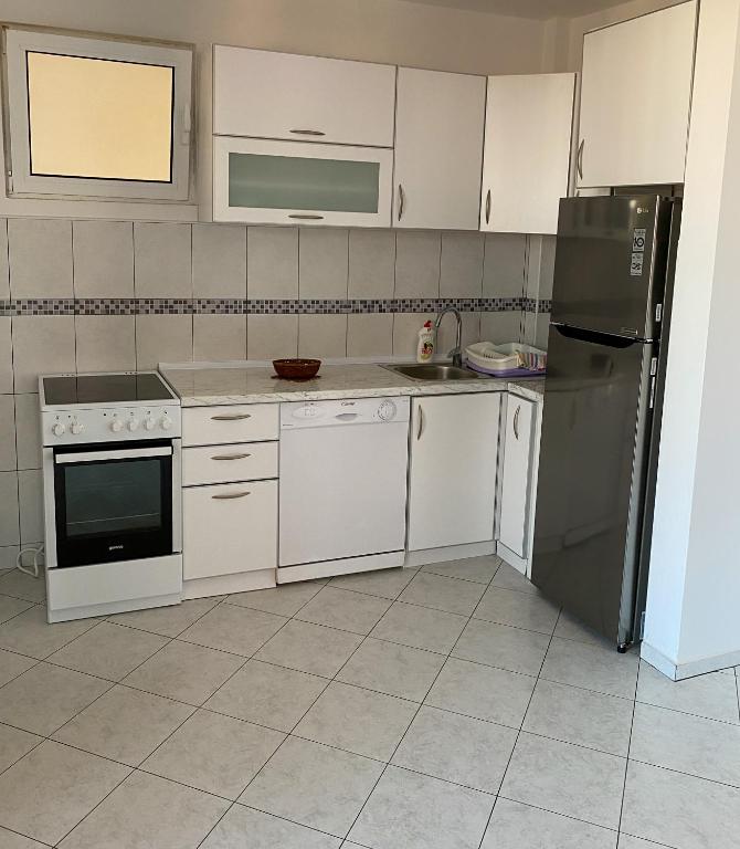 Kuchyň nebo kuchyňský kout v ubytování Villa Perla