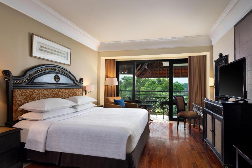 TV a/nebo společenská místnost v ubytování Mustika Yogyakarta Resort and Spa
