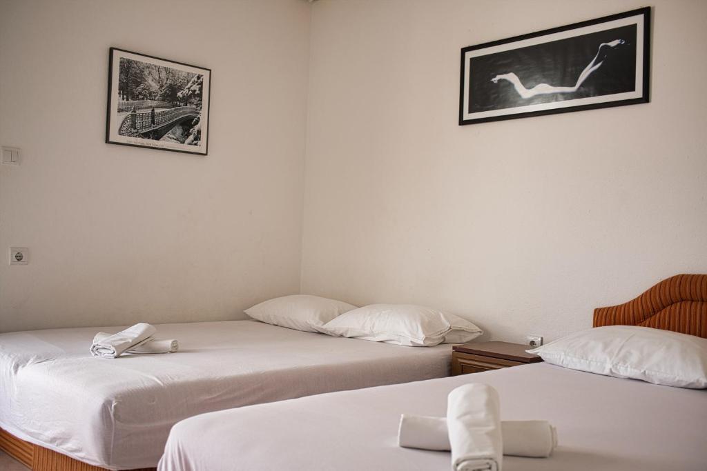 Postel nebo postele na pokoji v ubytování Villa Perla