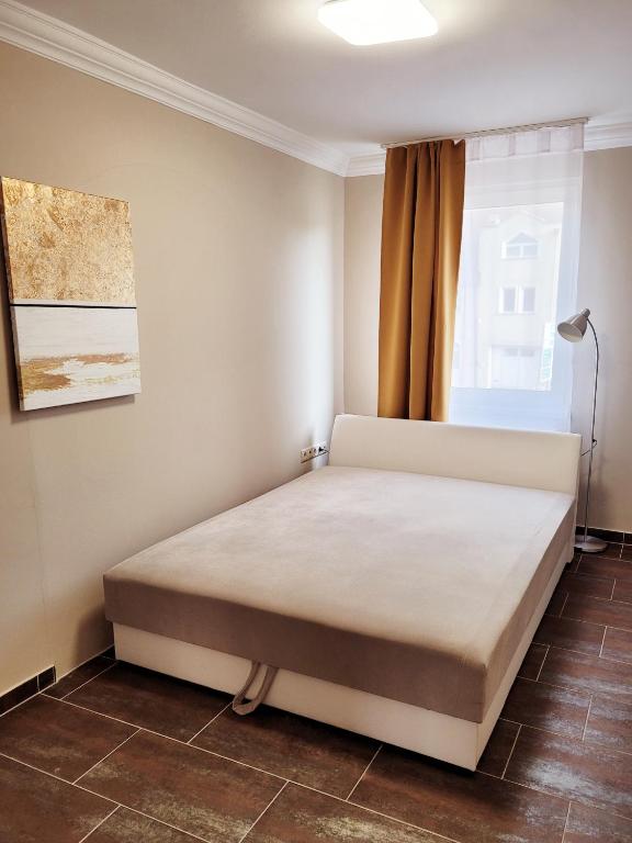 Postel nebo postele na pokoji v ubytování Indira Vendégház