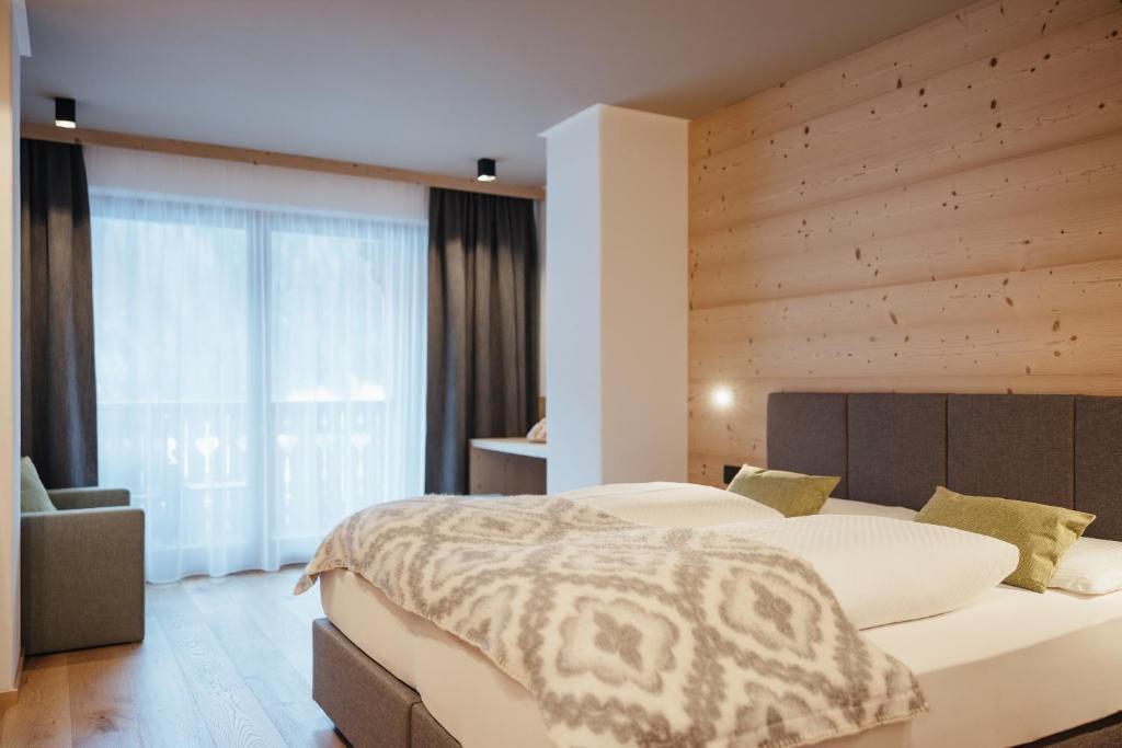 Postel nebo postele na pokoji v ubytování Berghotel Sanví