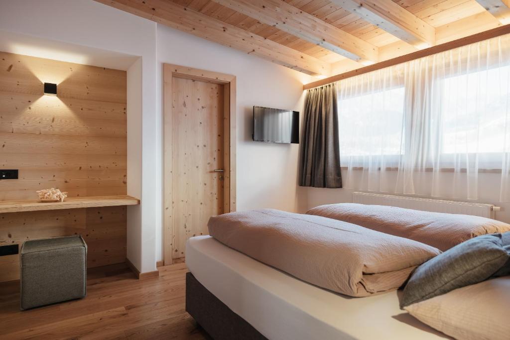 TV a/nebo společenská místnost v ubytování Berghotel Sanví