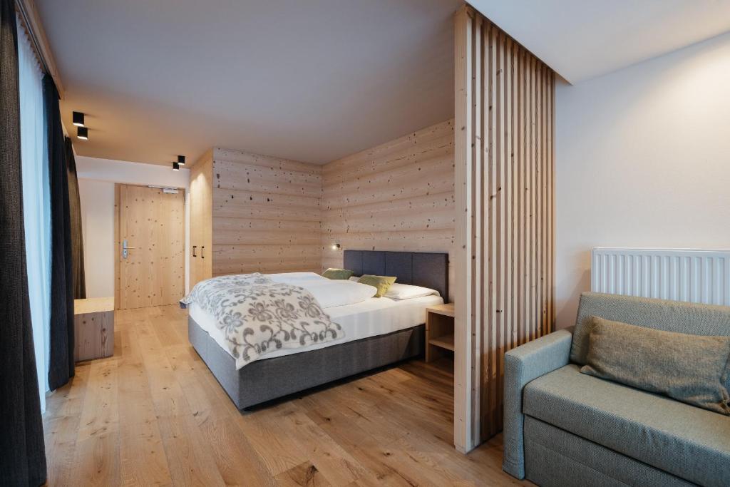 Postel nebo postele na pokoji v ubytování Berghotel Sanví