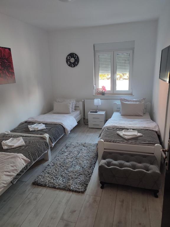 Postel nebo postele na pokoji v ubytování Apartman DORA