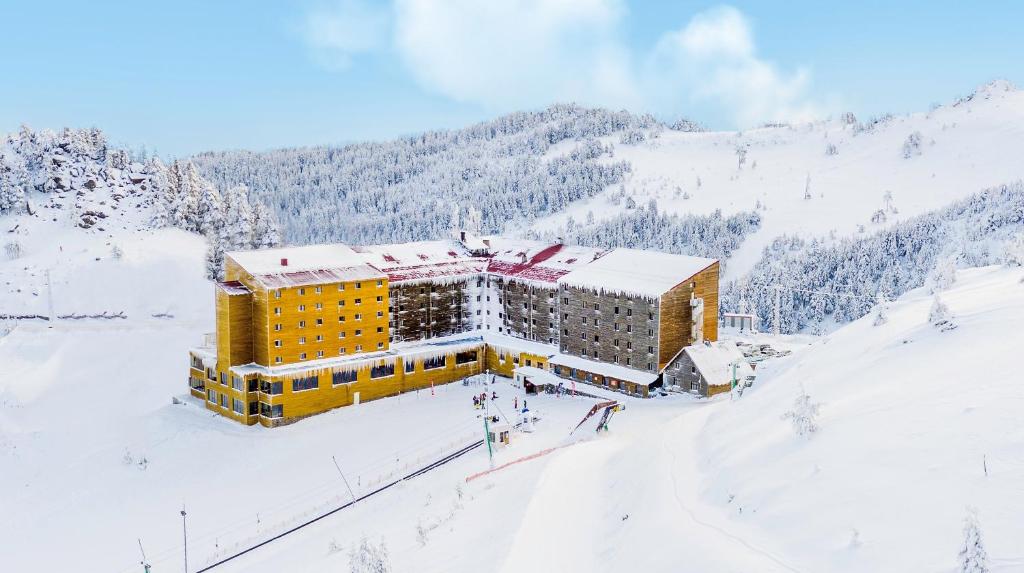 a hotel in the snow on a snowy mountain at Dorukkaya Ski & Mountain Resort in Kartalkaya