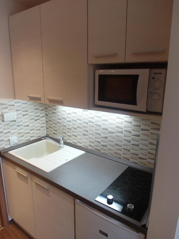 Kuchyňa alebo kuchynka v ubytovaní Tip-Top Apartmenthouse