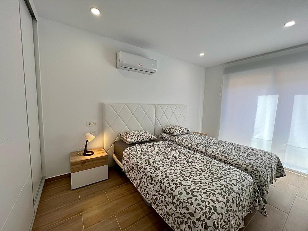 Postel nebo postele na pokoji v ubytování Apartamento Sunrise Chapaprieta