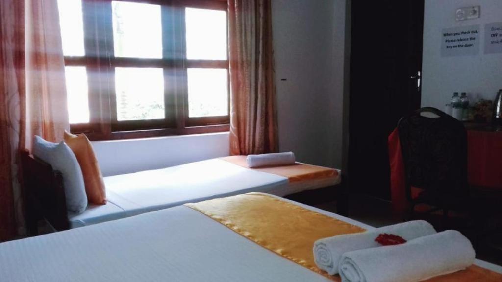 Postel nebo postele na pokoji v ubytování Villa DeLorenta