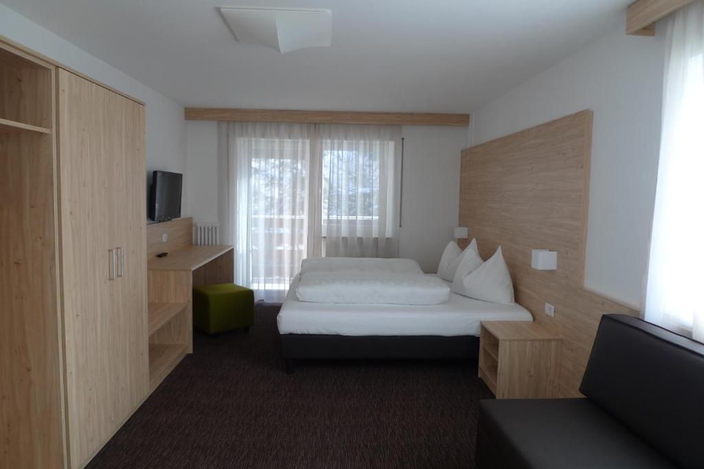 Postel nebo postele na pokoji v ubytování Hotel Stifter