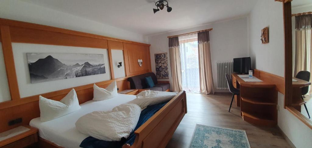 Postel nebo postele na pokoji v ubytování Alpenlandhaus