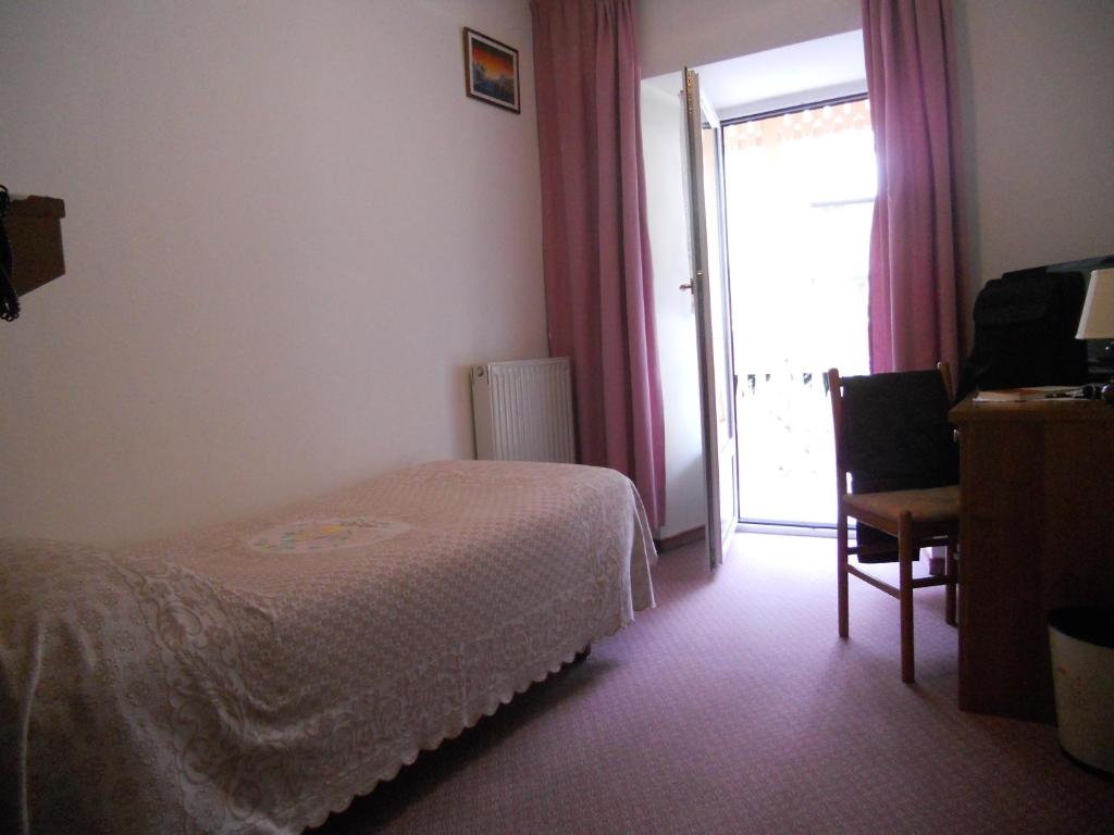 Postel nebo postele na pokoji v ubytování Hotel Garni Excelsior