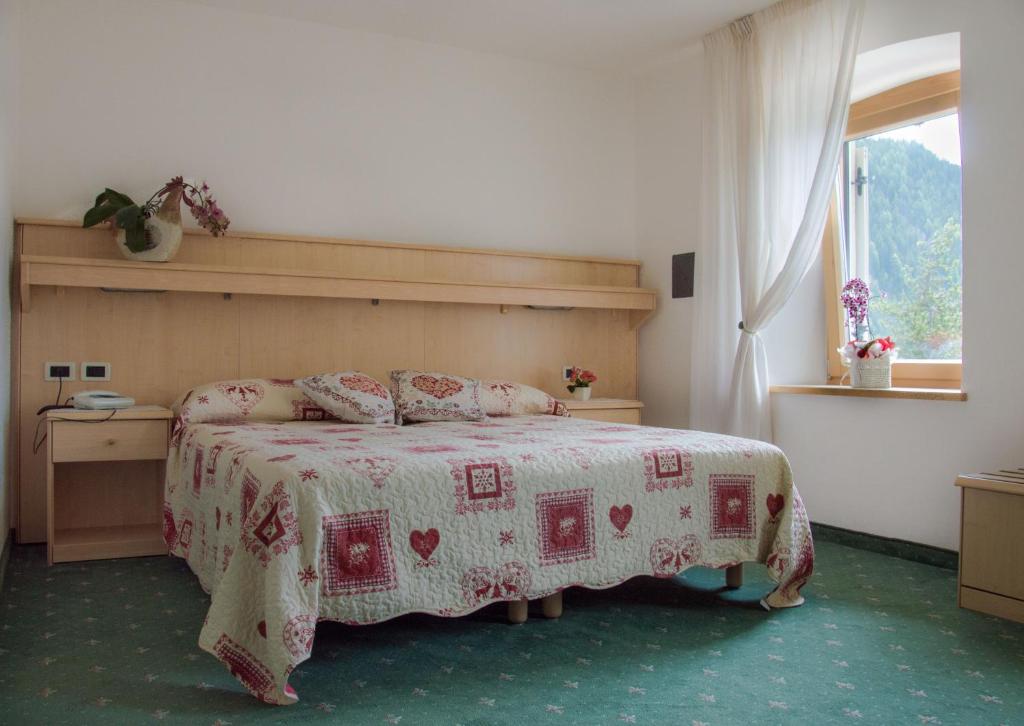 Postel nebo postele na pokoji v ubytování Hotel Garni Excelsior