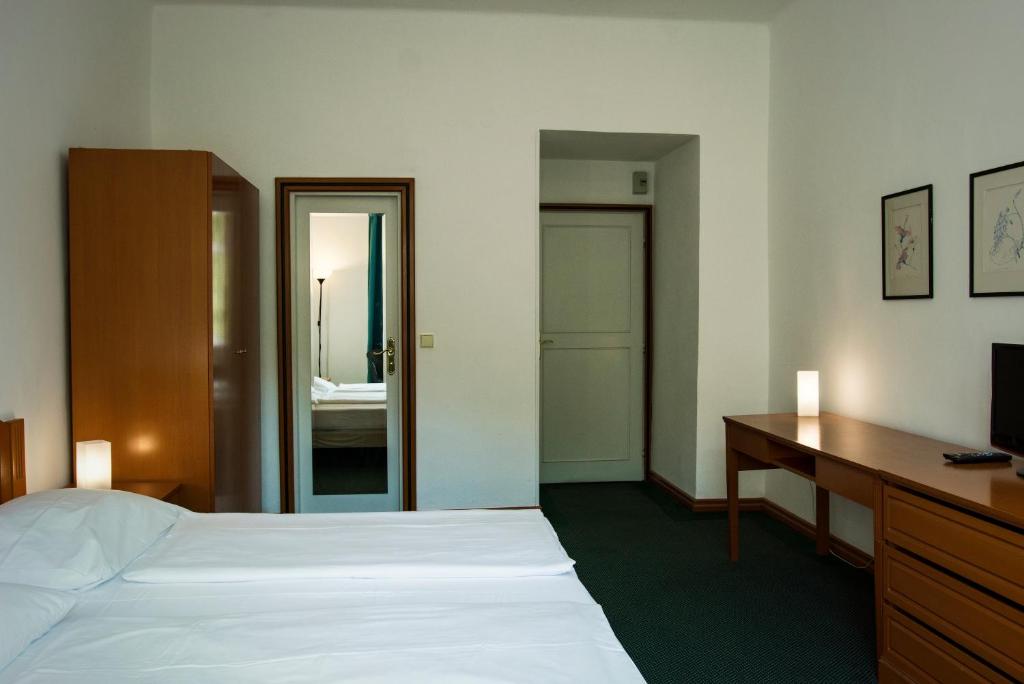 Postel nebo postele na pokoji v ubytování Vila Josefina