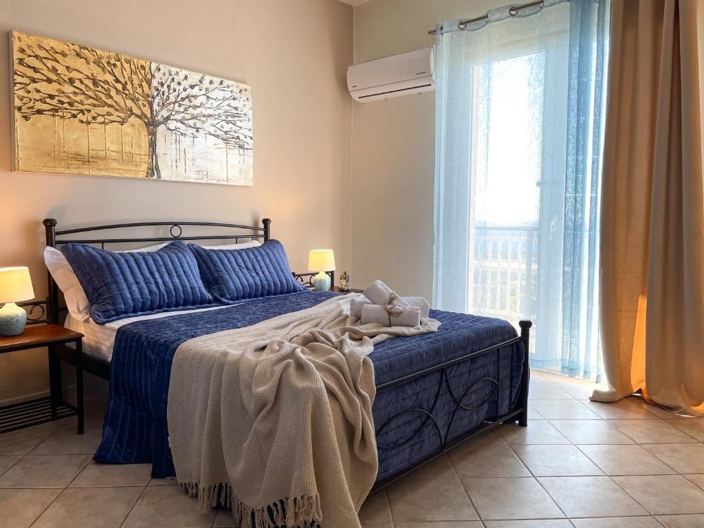 A bed or beds in a room at Drosia Superior Sea View Apartment