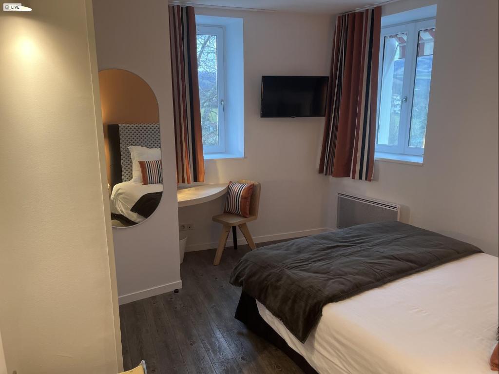 Postel nebo postele na pokoji v ubytování Hôtel Chilhar