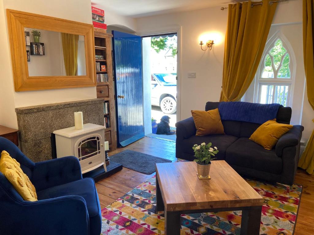 a living room with a couch and a coffee table at Rathjarney Gatelodge in Wexford