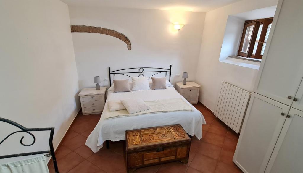 Łóżko lub łóżka w pokoju w obiekcie Agriturismo Barbadoro